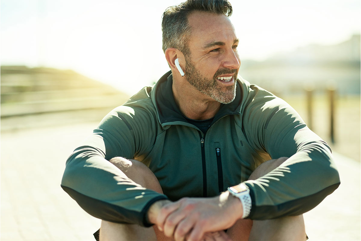 Middle aged man smiling and outside after testosterone replacement therapy in St. John, IN